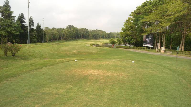 golf-hsinchu10 wide, open outdoor view of a grassy golf course fairway flanked