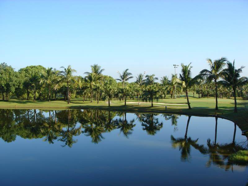 golf-kaohsiung-pt11 tranquil view of a water body reflecting the surrounding trees and blue sky