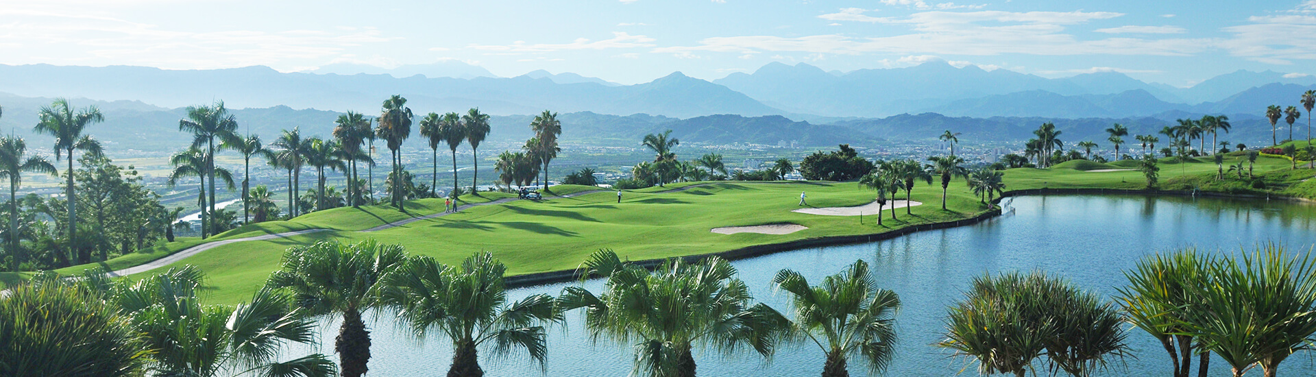 panoramic view of a coastal golf course with lush green fairways