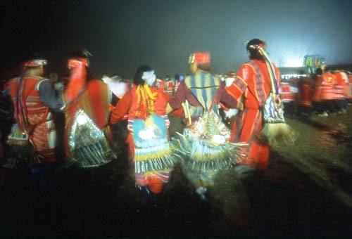 imgi_48_event23 dancers are wearing traditional red clothing and carrying distinctive ritual bells