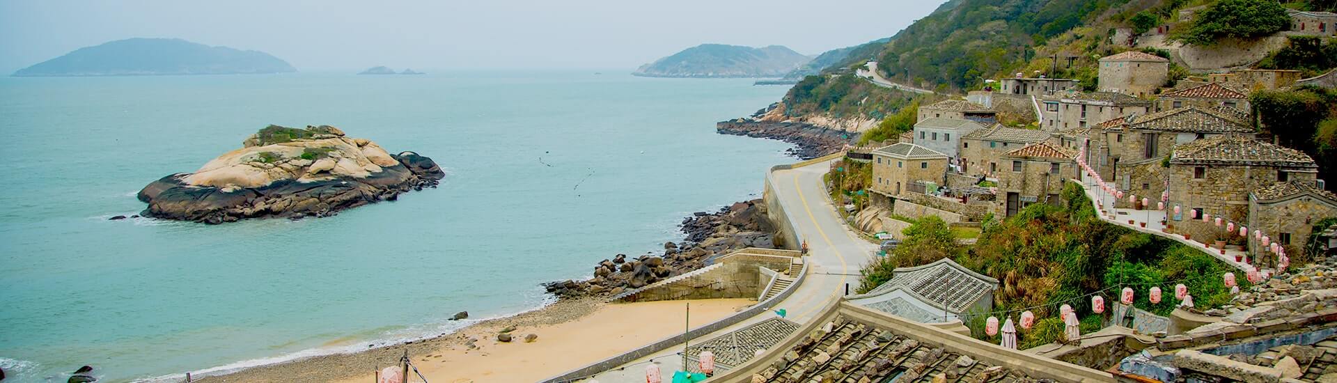 Traditional stone architecture and scenic harbor view in Matsu Islands, Taiwan.